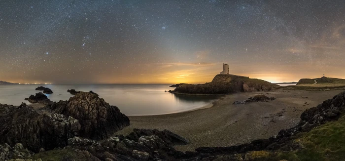 shore with starry sky background illustration porth Twr 2k
