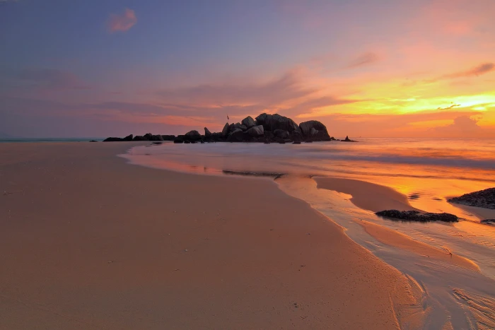 Sunset over the sandy beach coastline dusk photo landscape 2k