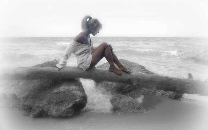 women blurred selective coloring on beach blonde 2k