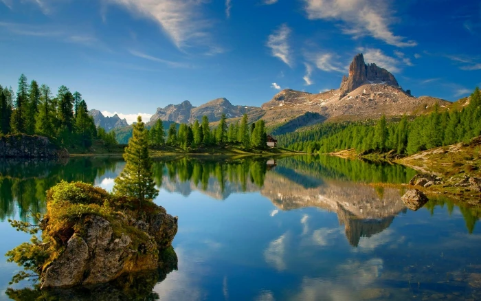 lake surrounded by pine trees Dolomites mountains forest 2k