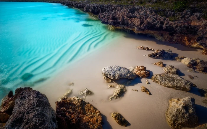 body of water near the rock formation during daytime nature 2k