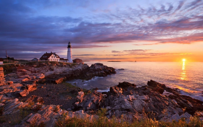 brown and white boat on body of water coast sky lighthouse 2k