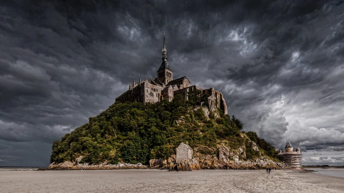 brown concrete castle on hill nature island beach Mont Saint Michel 2k