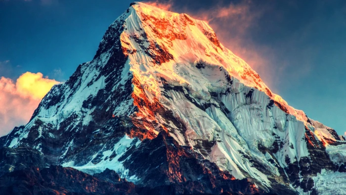 gray mountain covered by snow during golden hour 2k