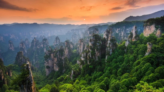 nature landscape Sun sunset mountains trees forest rock formation 2k