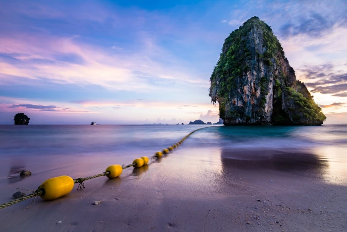 rock formation on body of water during daytime Phra Nang Beach 2k