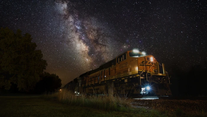 yellow train night lights Milky Way landscape nature galaxy 2k