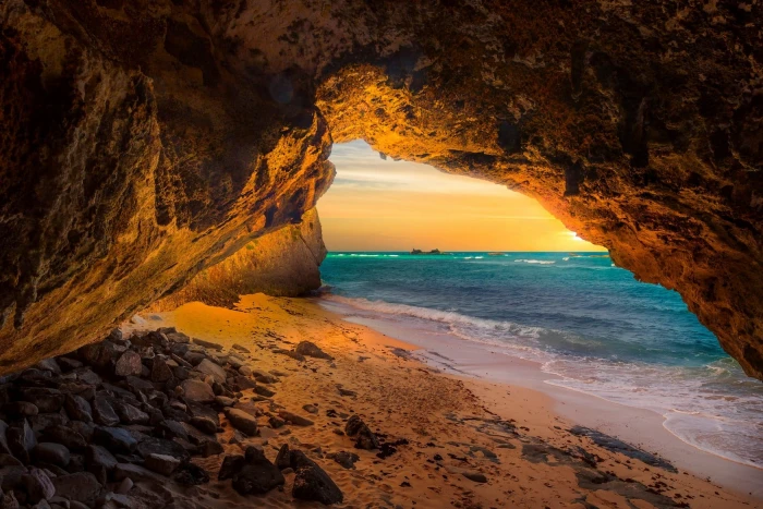 photo of cave and ocean landscape nature beach sea sunset 2k