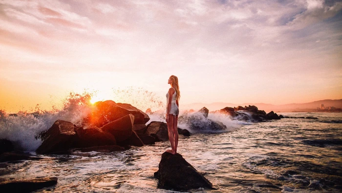 sea women beach water rock object solid sky sunset 2k