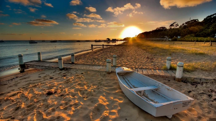 Beach sand boat sunset water 2k