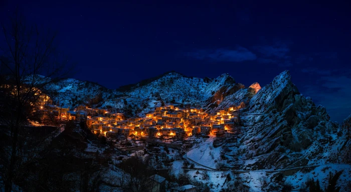 photo of house on mountain night clouds nature lights snow 2k