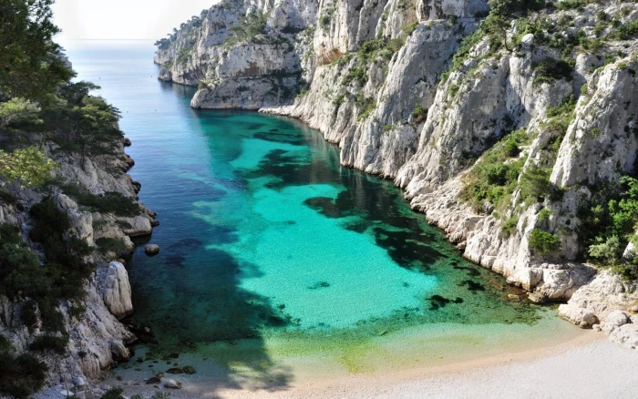 Calanque D en Vau Is One Of The Most Beautiful French Beaches Surrounded By Stone Walls Overhanging Water Wallpaper For Desktop 2k