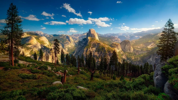 green leafed trees mountains nature landscape blue sky beauty in 2k
