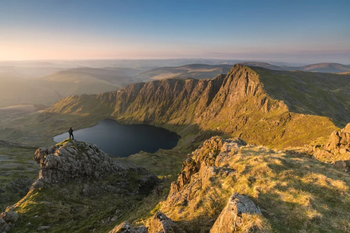 person on top of mountain cader idris snowdonia 2k