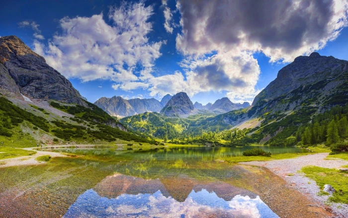 body of water and mountain ahead nature landscape mountains 2k