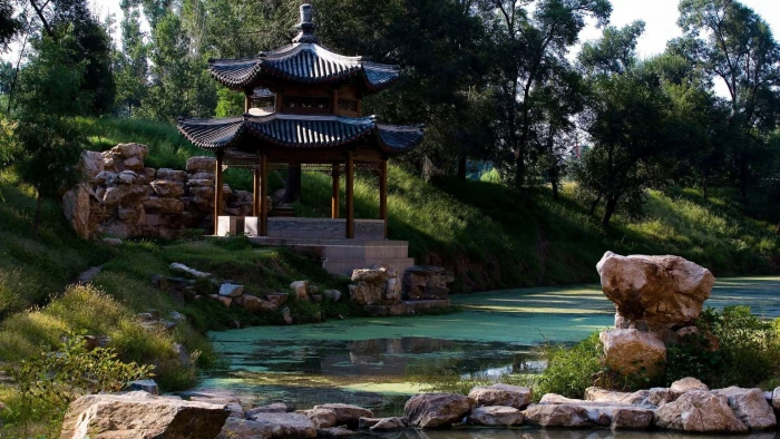 brown wooden temple near body of water nature landscape architecture 2k