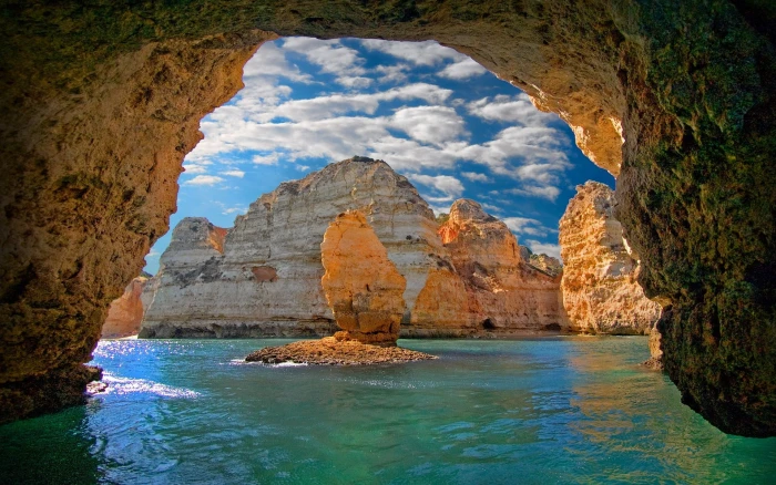 brown rock formation nature landscape cave sea island clouds 2k