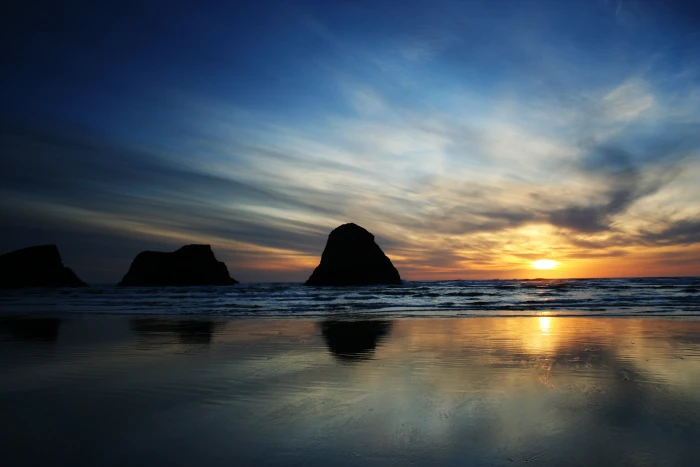 photography of sea shore during sunset cannon beach 2k