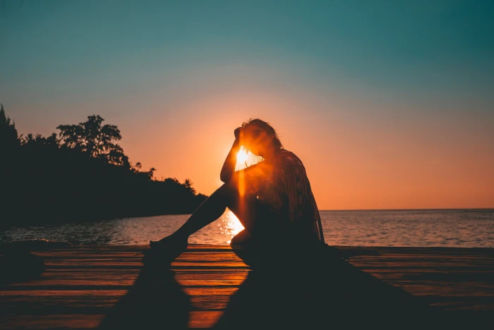 silhouette of woman photo person sitting on beach 2k 4k
