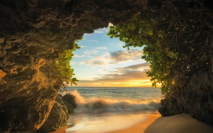 brown rock formation and body of water nature landscape beach 2k