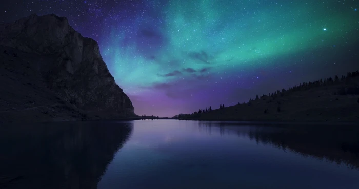 blue body of water aurora borealis above the beside mountain 2k 4k