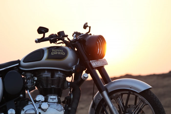 black and grey Royal Enfield motorcycle on brown field bullet 2k 4k 5k