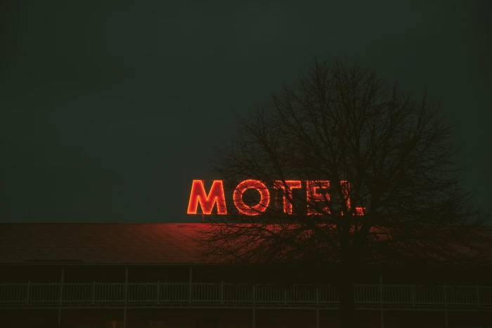 red neon light Motel signage turned ON holiday vacation hotel 2k 4k 5k