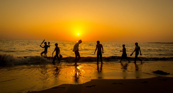 silhouette of mans standing seashore during sunset beach cricket 2k 4k
