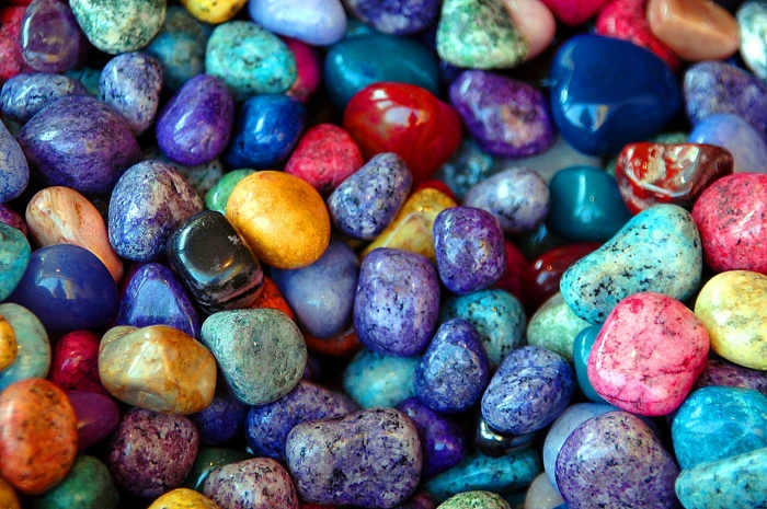 macro shot of multicolored pebble stones colorful rocks background 2k