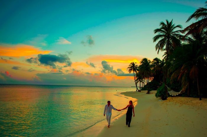 Man and Woman Holding Hand Walking Beside Body of Water during Sunset 2k 4k