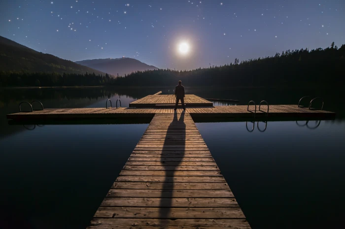 man standing on dock during night time alone astronomy blue 2k 4k 5k