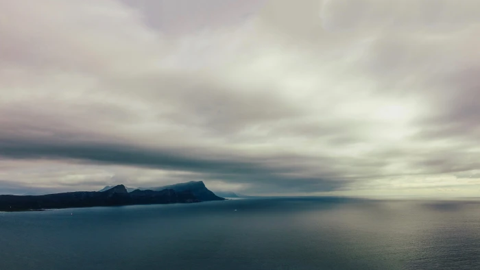 cloudy sky over hill in beach sea ocean nature land outdoors 2k 4k 5k