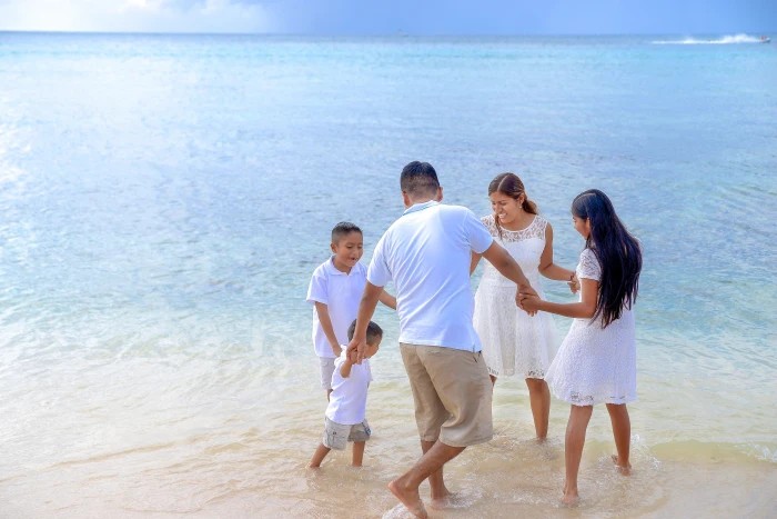 family holding hands circle on seashore at day time vacation 2k 4k