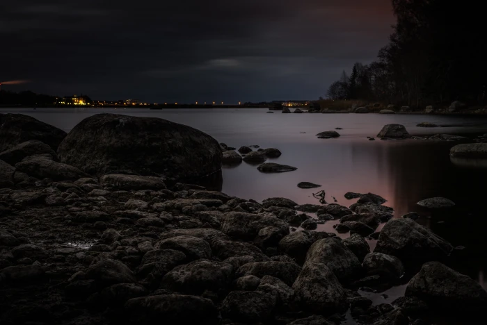 landscape photography of rocks near lake on the Beach nikon d 2k 4k 5k