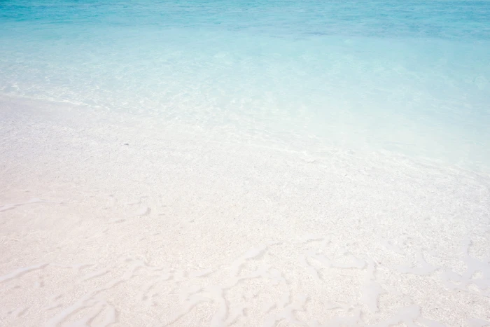 wave of water on sea shore white sand beach during daytime texture 2k 4k 5k