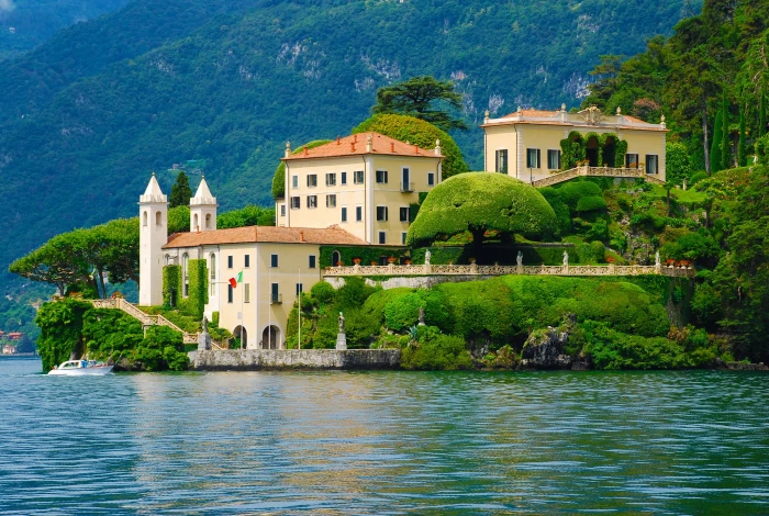 white structure beside body of water mansion lake como italy 2k
