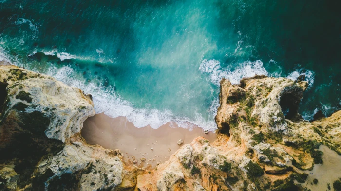 aerial photo of beach sea ocean wave drone sand stone rock 2k 4k