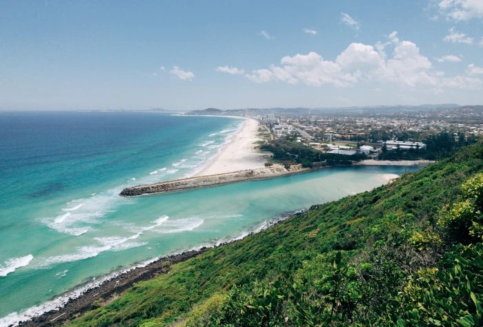 beach near city water outdoors nature sea ocean land shoreline 2k 4k