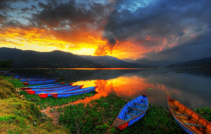 landscape photography of canoes near lake during sunset phewa pokhara nepal 2k 4k
