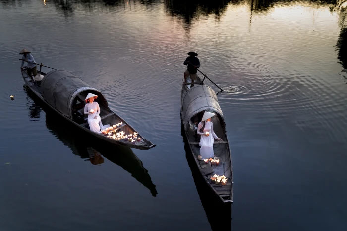 Four Person Using Two Boats on Calm Sea action ao dai boatman 2k 4k 5k 8k