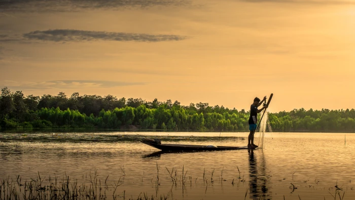 man on boat holding fish net Outside House Thailand Plant 2k 4k 5k