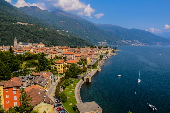 aerial photography of houses beside body water lago maggiore 2k 4k 5k
