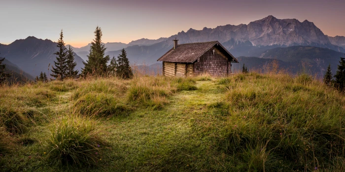 brown wooden house on top of mountain during golden hour Alm 2k 4k