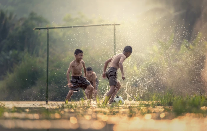 tilt shift photography of children playing with water football 2k 4k 5k