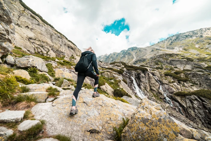 Young Fit Woman Hiking to the Waterfall Mountain adventures 2k 4k 5k