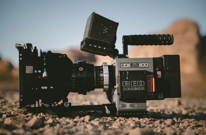 selective focus photography of shoulder mount camera on ground black and gray during daytime 2k 4k 5k