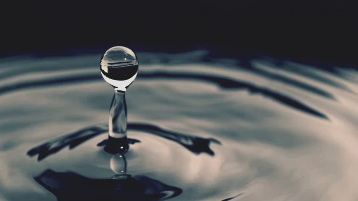 body of water droplet drops macro ripples nature 2k
