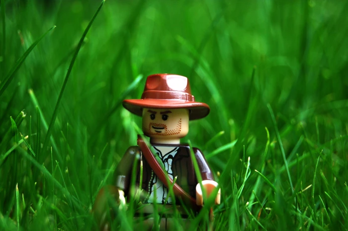 cowboy Lego toy on grass macro photography LEGO Indiana Jones 2k