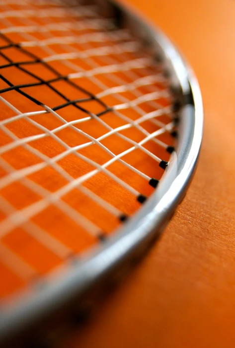 macro lens photography of metal racket sport badminton bat 2k