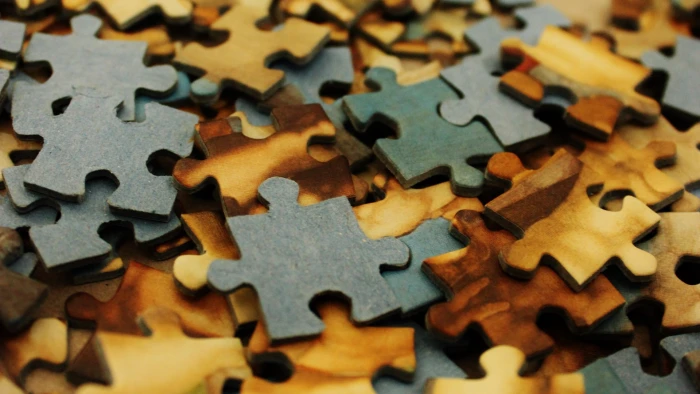 puzzles macro jigsaw piece puzzle close up indoors 2k